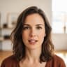 Video clip thumbnail featuring a woman in her thirties with wavy brown hair